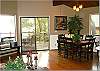 Dining for six open to the kitchen and living room.
