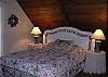 Cozy bedroom with a queen bed upstairs.