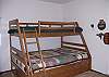 Located on the upper level.  Has a full size bed and a twin size bed.