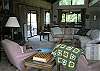 Living room ha open beam vaulted ceilings.  Plenty of room to relax.  This room is located on the main level and is open to the game table and dining area.