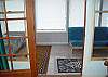 comes with a full size futon and tile floor.