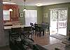 Open to the kitchen and living room.  Sliding glass door opens to the deck.