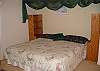 King size bed with attached master bath. Also has a sunroom thru french doors.