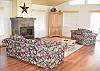 Located on the main level with a propane fireplace and is open to the dining area and kitchen.