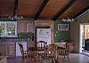 Open area to the kitchen and living rm. with sliding glass doors that lead out onto the back deck.
