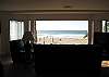 Here's that view we've been talking about! You are right on the beach with the sand volleyball courts directly in front of your large shared patio. Grab the kids and the burgers and bbq while watching the fun!