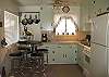 Your beach house kitchen is fully stocked with dishes, pots and pans, coffee pot, microwave and toaster.