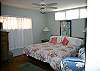 One room offers a King bed and access to bathroom.