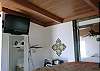 Watch TV from the raised queen bed or the futon!