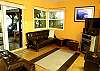 The Sleeper Sofa has a great view of the Flat Screen TV, and many of the excellent framed photography in this well-decorated unit. Step right out onto your deck with the hammock, hot tub, and oceanview!