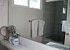 The secondary bathroom also features a large soaking tub.
