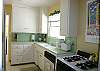 Kitchen offers small appliances, stove, dishwasher, refridge and microwave. Fully stocked with dishware, flatware, and cookware.