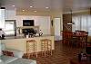 Sadie's features a breakfast bar and formal dining table. The living room opens onto the patio for grilling and outdoor dining too!