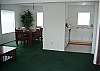Kitchen area is open to dining area with a breakfast bar and fully dining table.