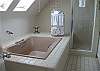 Master bathroom offers a private bathroom with shower and large soaking tub! Skylights light up the room.