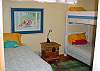 Second bedroom offers three twin beds for the kids just over from the Main bedroom.