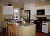 The open kitchen is perfect for whipping up Sunday morning pancakes for the family! You can watch the game while prepping your meal as the kitchen, dining and living room are one big open entertaining area.