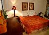 This bedroom is adorably decorated with a Tommy Bahama feel, writing desk features internet connection, there is aTV tucked in the armoire and a full bath attached!