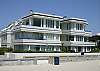 The 3rd level condo offers a view North up the coast and also frontal ocean and sunset views! This complex offers 8 units total.