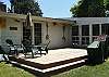 Back patio area includes BBQ and outdoor shower to rinse off after a day at the beach.