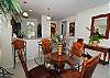Conmfortably seats 4 to 6 with additional bar stool seating at the kitchen counter.