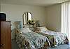 Bedroom 2 features 2 twin beds with bathroom ensuite as well as south-facing Ocean View Balcony!