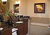 Features double sinks, soaking tub, separate shower.  Also includes bathrobes, makeup mirror, hairdryer.