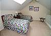 This bedroom features 2 Twin Beds with optional King Bed upon request at time of booking.