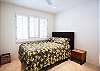 fourth bedroom with queen bed and shared bath