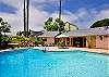 Go poolside and relax in this tropically inspired cottage