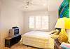 third bedroom with queen bed and shared bath