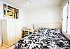 fifth bedroom with queen bed and shared bath