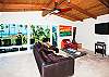 ocean view living room with comfortable seating for 6 and flatscreen TV