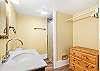 Spacious bathroom with a stand up shower. Shampoo, conditioner and towels are also available. 