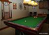 Ground floor, den area has a pool table wet bar with fridge, microwave. Back door leads to hot tub and ski run.
