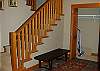 Foyer at main entrance with heated floors and large coat closet.