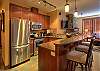 Granite counter tops and stainless steel appliances.