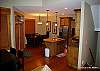 Main floor- 2 dining tables comfortably seat 18 adjcent to kitchen.