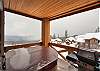Private balcony with hot tub and bbq which overlooks Rockridge Court and the Monashee Mountains.