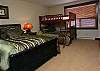 Has a queen bed, single-over-double bunk bed.