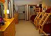 Mid floor- 5th bedroom 2 sets of bunks with single over double bed. Large built in closet, TV, chest of draws.