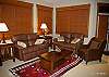 Mid floor lounge with ample seating and door leads onto a balcony and fantastic views.