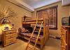 Single-over-double bed, bedside table, window overlooking the Village Way down to the gondola. Shared bathroom adjacent.