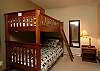 Single-over-single bunk bed, window over looks hot tub deck. Has ensuite bathroom.