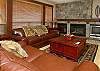 Leather sofas, one of which is sofa bed. Window overlooks Building 2