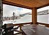 The private balcony has a BBQ and hot tub, with great views of the mountain