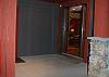 Enter into a hallway with heated slate floor. Garage door to left.