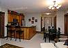 Dining table with 4 chairs. Breakfast bar with 2 stools.