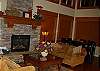 Main floor living room and dining table.The picture windows over look forest and mountains.