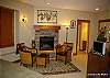 Top floor- master bedroom has its own lounge area with gas fire, TV, left door leads to bathroom and right door leads to passage.